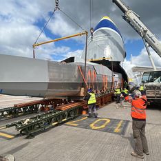 Unloading cargo from international cargo transporter plane